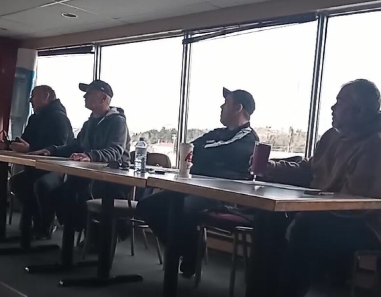 Members of Horse Racing N.B.'s board speak to horse owners at a meeting in Saint John Dec. 10. President Guy Barbara is on the left. Charlie Miles is next to him.