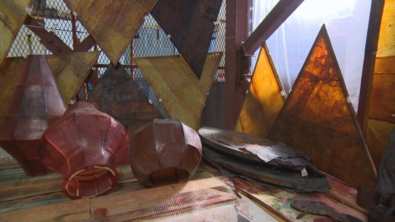 Lanterns and triangles made from sheets of leathery membrane, created from kombucha mushrooms.