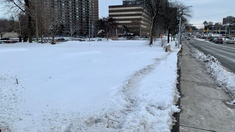 A photo of an empty site at Bank Street and Riverside Drive that needs to be de-contaminated before development can happen.