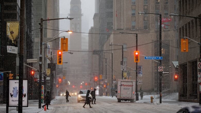 Torontonians navigate icy conditions and blowing snow on Dec. 23, 2022.