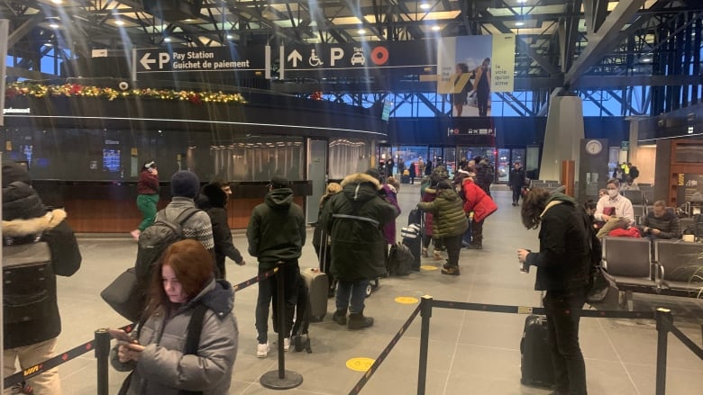 Passengers wait for delayed or cancelled trains in the VIA Rail station in Ottawa.