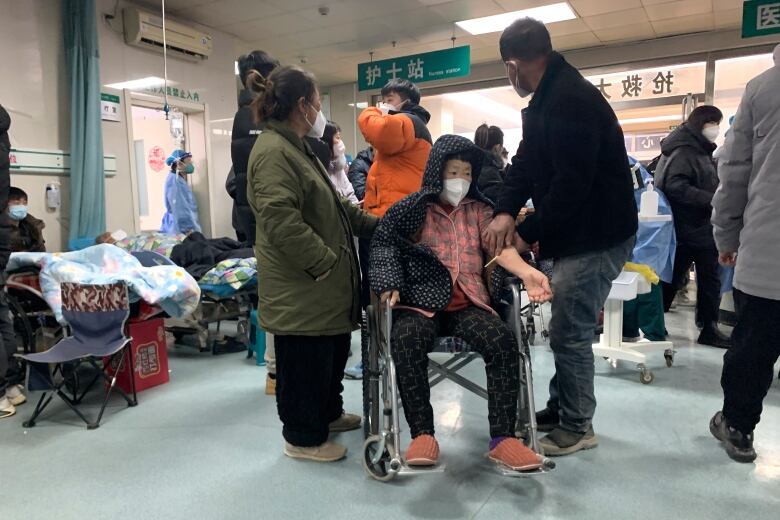 A boy sits in a wheelchair awaiting treatment at a hospital in northern China.