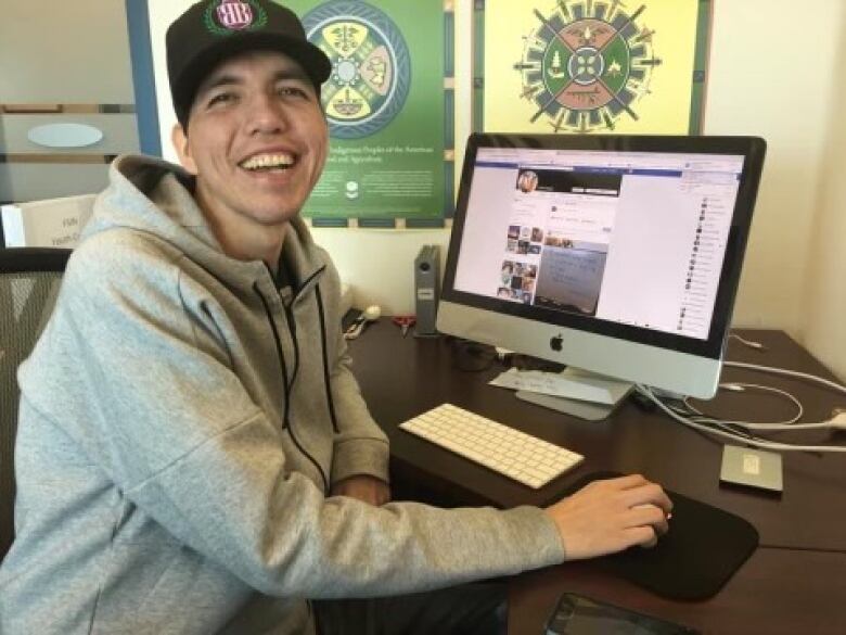 Cole Cappo in front of a computer.