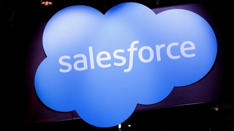 A blue, cloud-shaped logo with the word Salesforce written at its centre.