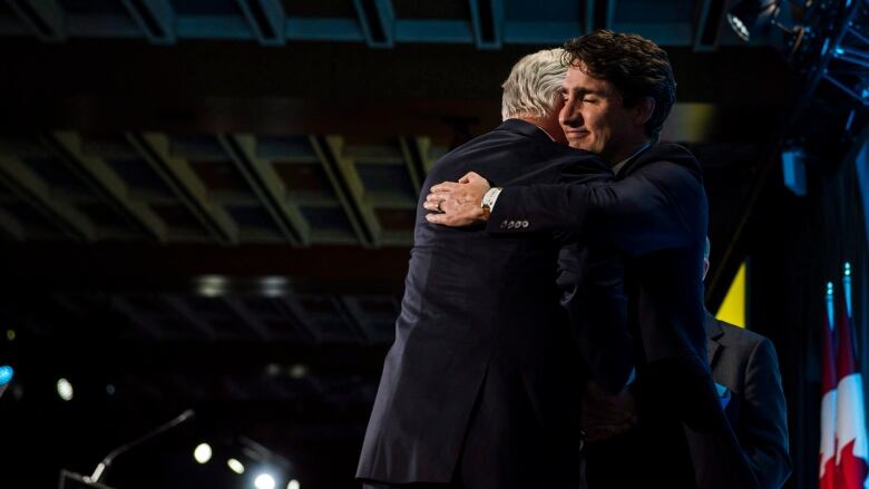 Prime Minister Justin Trudeau awards Dominic Barton, Global Managing Partner at Mckinsey and Company.