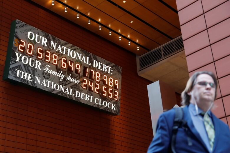 This Congress will have to approve new debt spending in several months or the U.S. risks a once-unthinkable possibility: a default on some of its debt. Seen here: A tally of the U.S. national debt, in a photo from New York City in 2017. 