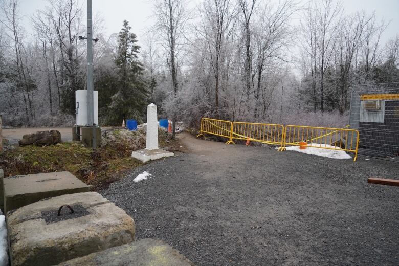 A dirt path with a marker. 