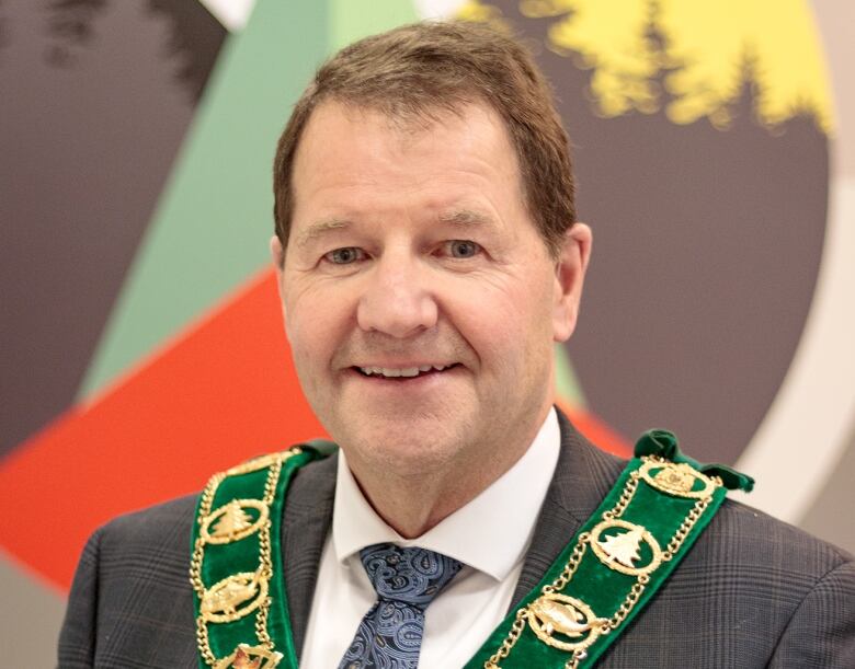 Jack Harrison, pictured wearing his chain of office, is the mayor of Dryden, Ont.