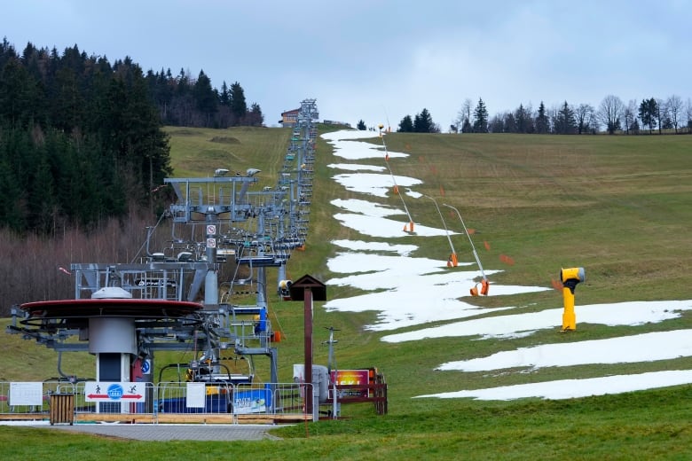 A ski lift in the Czech Republic is closed because there's not enough snow due to the unseasonably warm weather in much of Europe during this winter.