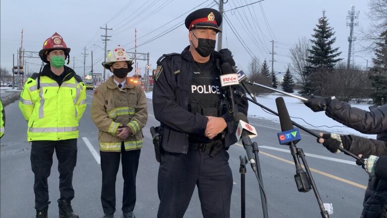 police speaking at Eastway Tank explosion site