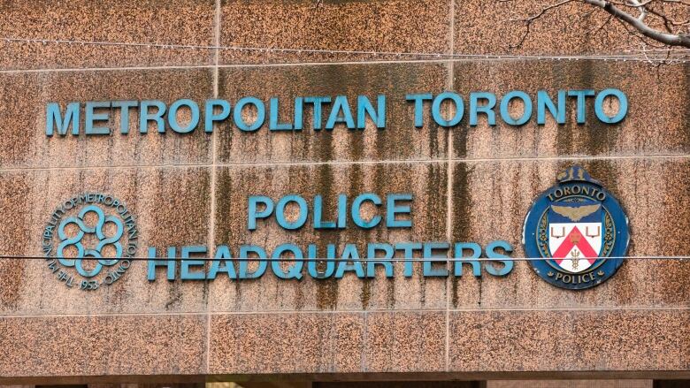 A sign reading Metropolitan Toronto Police Headquarters on a building downtown.