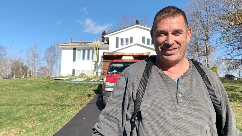 Roofer Delton McDonald working at a home a few weeks after post-tropical storm Fiona.