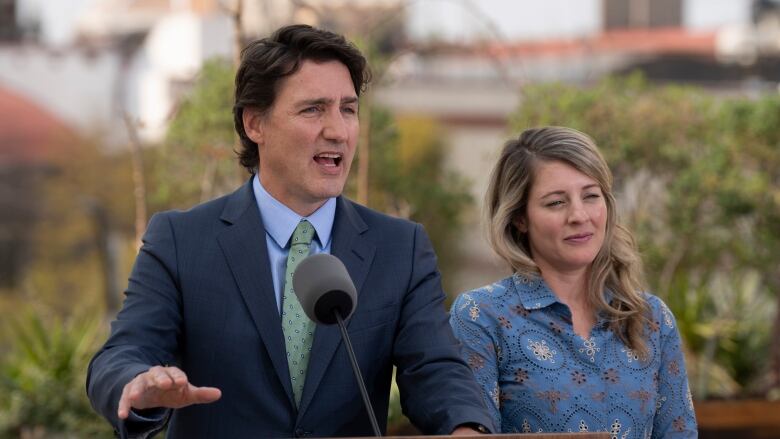 Foreign Affairs Minister Melanie Joly looks on as Prime Minister Justin Trudeau responds to a question during a media availability, in Mexico City. 