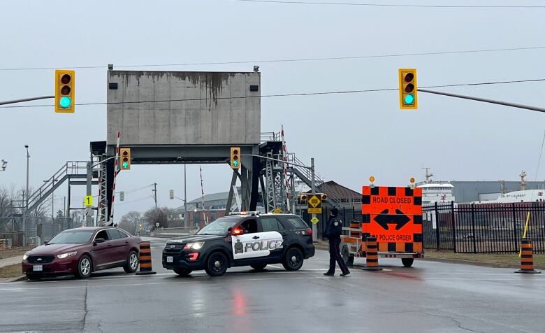 Niagara Regional Police block off a bridge near Lock 1 off the Welland Canal following an early morning explosion and fire in the surrounding area, in St. Catharines, Ont., on Thursday Jan. 12.