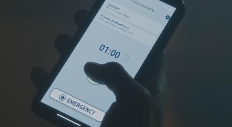 A close up of a smartphone which displays the Alberta government's Digital Overdose Response System app. The screen shows the one minute timer which counts down to an alarm to ensure a person using drugs is still conscious.