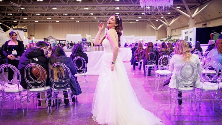 A model poses in a wedding dress at Canadas Bridal Show, at the Metro Toronto Convention Centre, on Jan. 13, 2023.