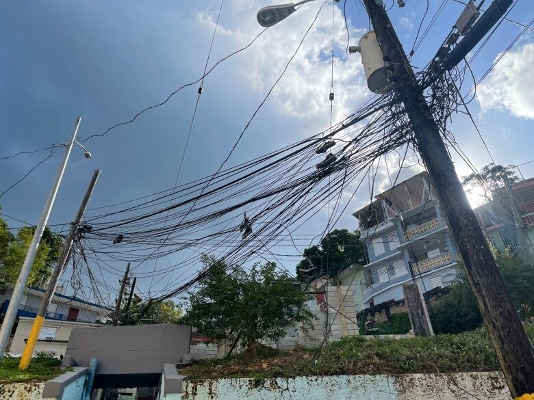 Power lines criss-cross the sky in the coastal city of Aguadilla, Puerto Rico.