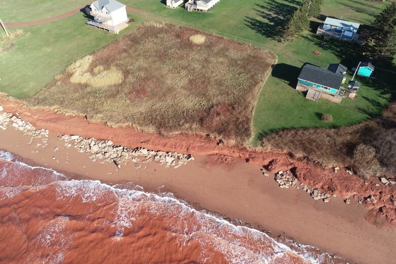 Drone view of a shoreline where concrete armouring was washed over during Fiona 