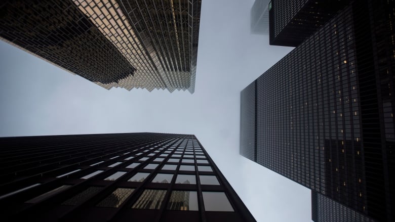 A file photo, from June 2018, looking up at some office towers in Toronto's financial district.