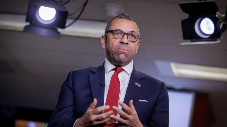 British foreign secretary James Cleverly speaks during an interview with CBC.