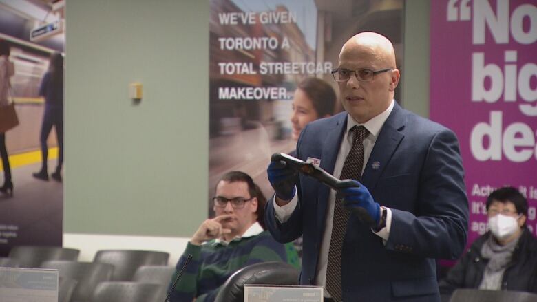 TTC chief operations and infrastructure officer Fort Monaco holds a frayed piece of electrical cord at a transit board meeting on Jan. 19., 2023. The TTC is set to close the subway system on a number of full weekends and divert streetcars over the next 12 months to conduct millions of dollars in repair work. 