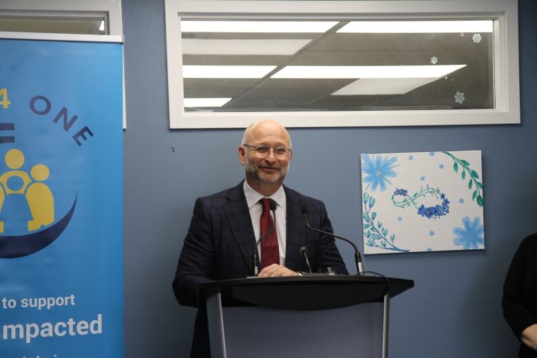 A man speaking at a podium.