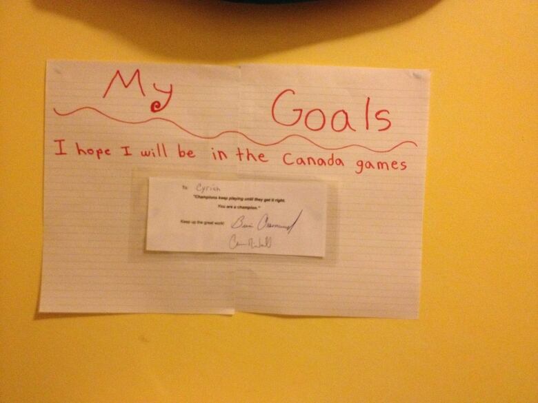 A note a child wrote committing she would one day play in the Canada Games.