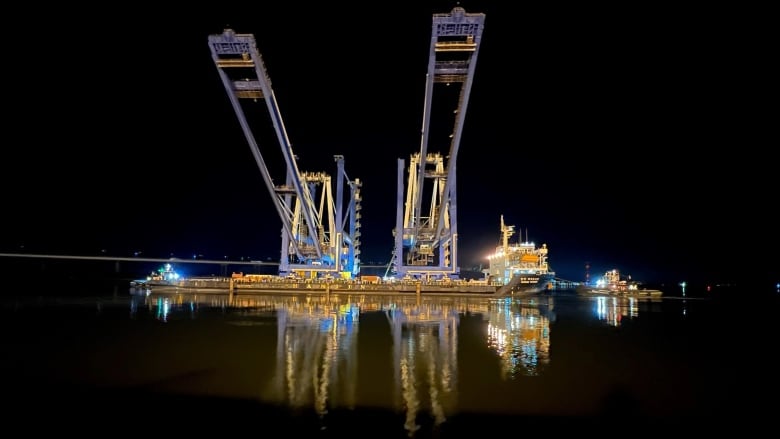 This photo of the two industrial cranes was taken earlier this year after their completion, but before heading out on their trek from Charleston, S.C., USA to Saint John, N.B.