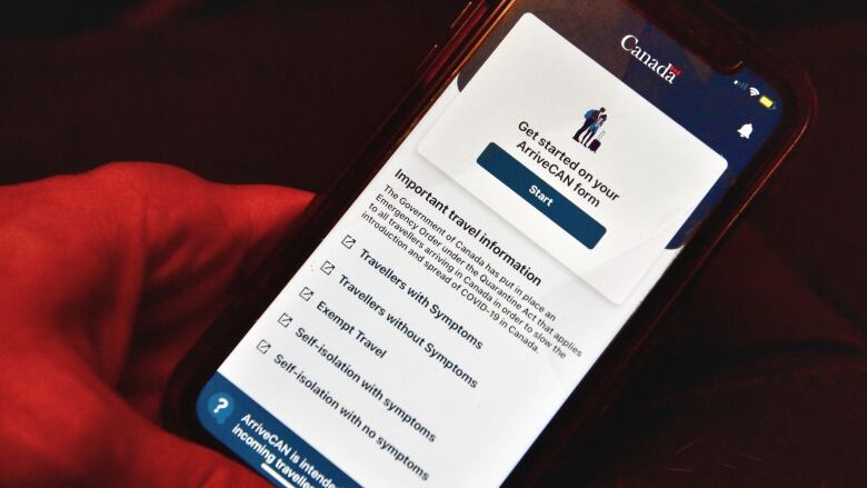 Closeup of a phone screen with ArriveCan app