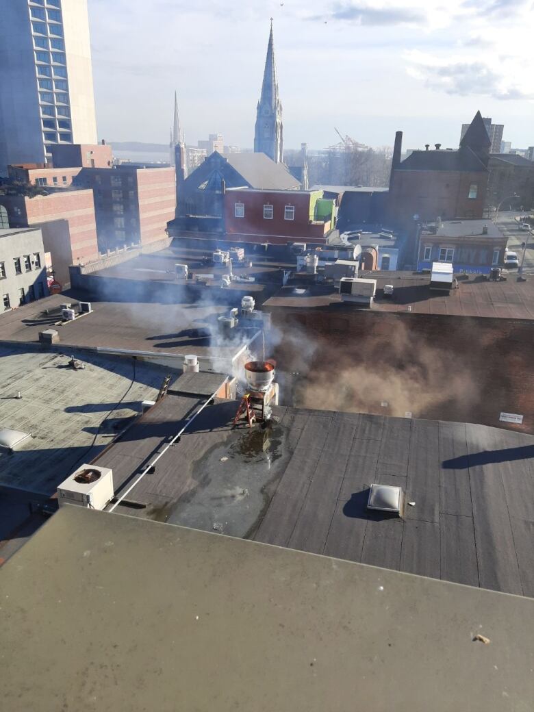 Red flames and smoke on the roof of a restaurant. 