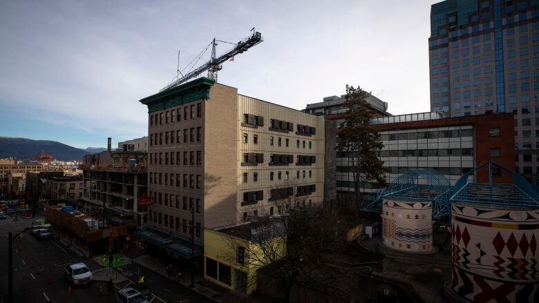 A beige multi-storey building is seen in Vancouver.