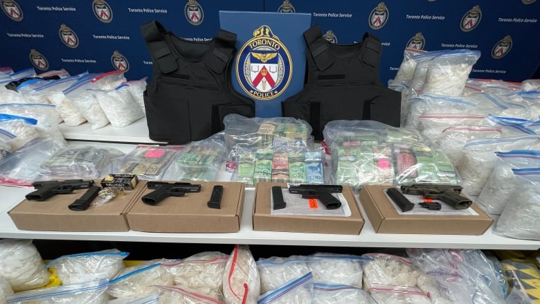 A photo of drugs and weapons seized as part of a 2023 Toronto police bust.