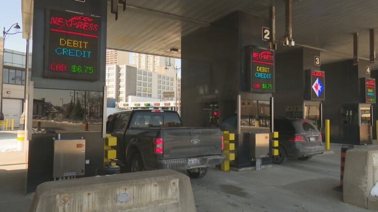 Vehicles travel through the tunnel toll booths on the Windsor side of the Windsor-Detroit Tunnel.