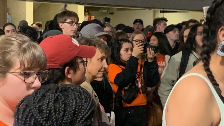 A crowd of students pack a room at the University of Lethbridge.