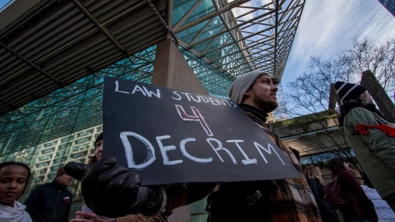 Advocates for drug decriminalization at a rally in 2018. This week, the province began a three-year pilot that will allow possession of small amounts of drugs.