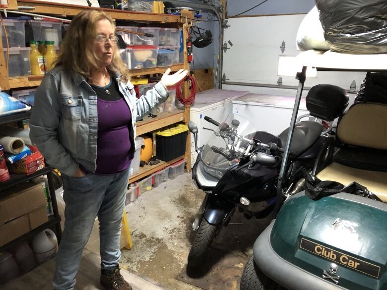 A woman in a garage.