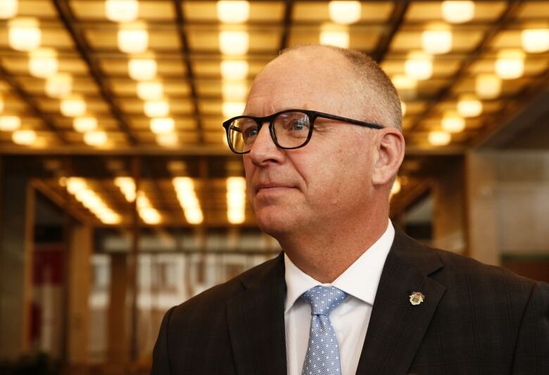 The head and shoulders of Winnipeg's mayor in the foyer at the council building.