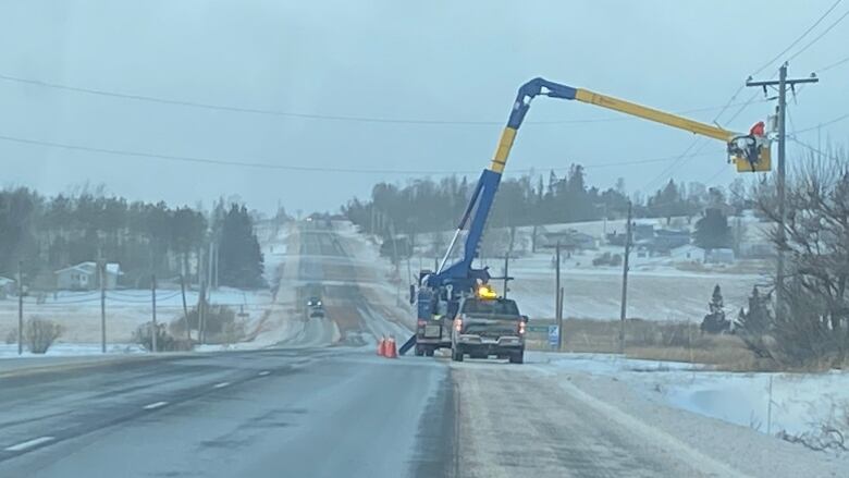 Maritime Electric crews work to restore power in Cherry Valley, P.E.I. on Saturday.