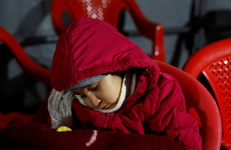 A young child bundled up.