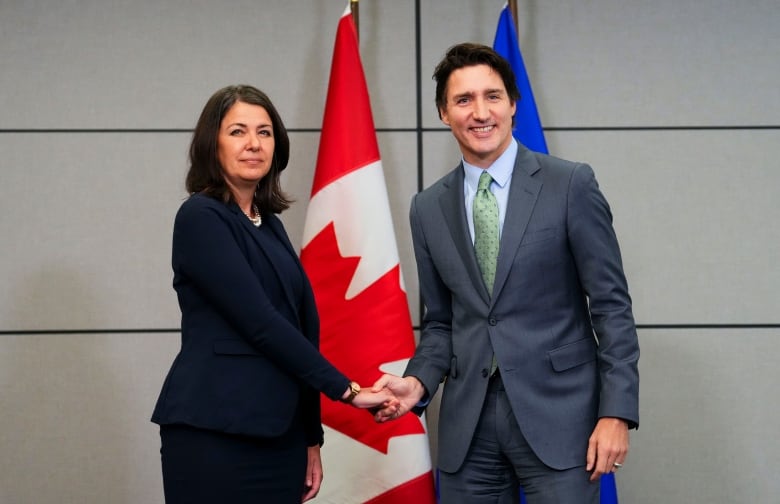 Alberta Premier Danielle Smith shakes hands with Prime Minister Justin Trudeau.