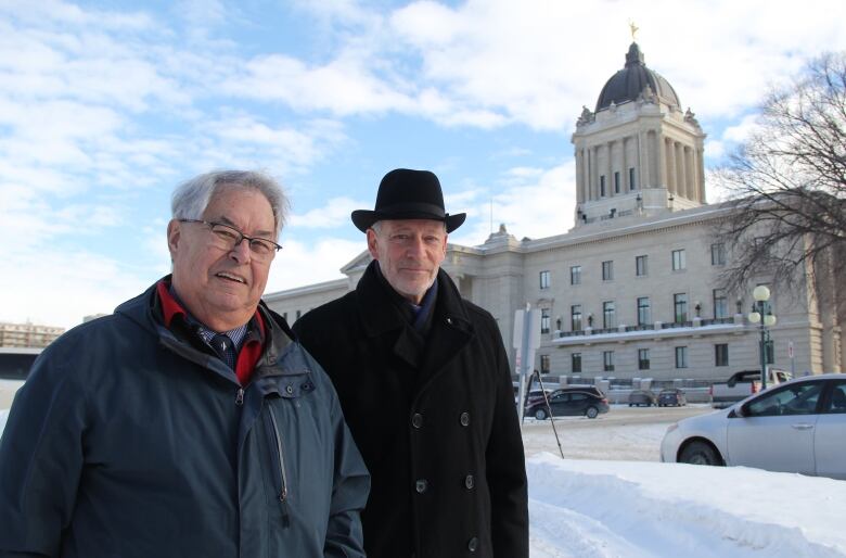 Two men, Bill Shead and John Perrin, stand along a path in the northwest corner of the Manitoba legislature grounds. It is the site where a statue of Chief Peguis is supposed to be erected. 