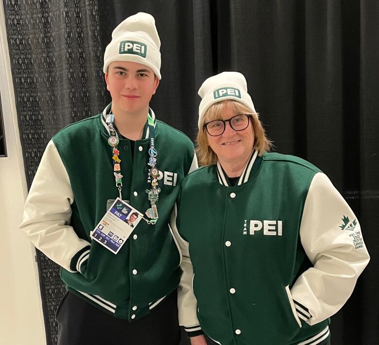 A woman and a young man in Team PEI jackets 