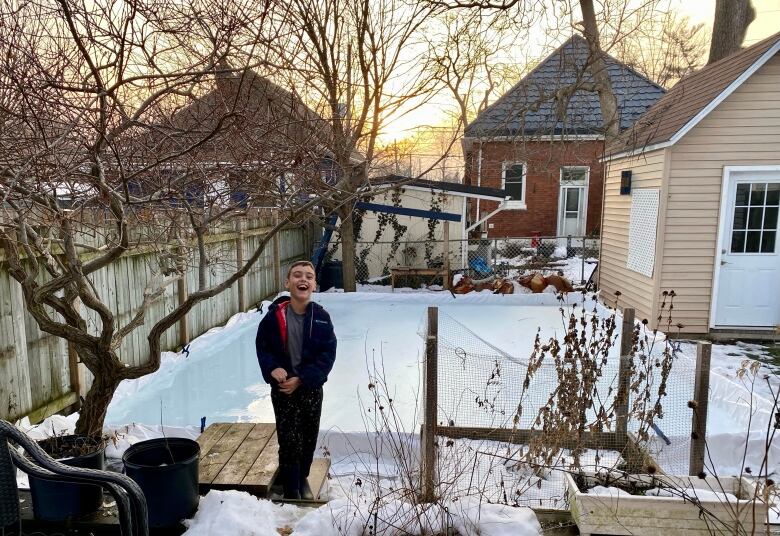 Bram Davis, 8, started playing hockey this year so his parents built him this backyard rink. But it's already too slushy to use.