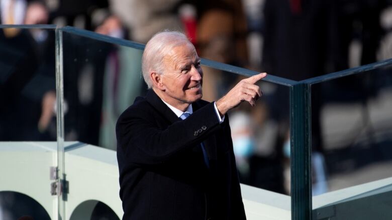 U.S. President Joe Biden points at attendees after being sworn in as the 46th President of the United States in Washington, U.S., January 20, 2021.