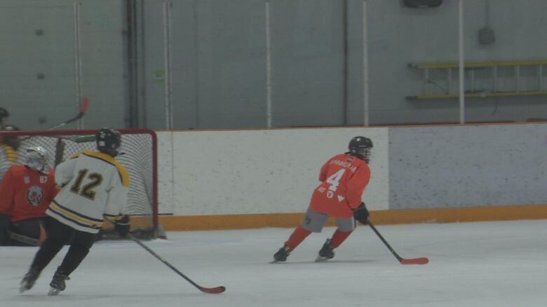 A hockey player skating