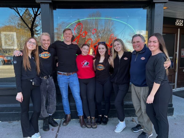 The Joe Kool's team standing outside their bar on Richmond Street in London, Ontario.