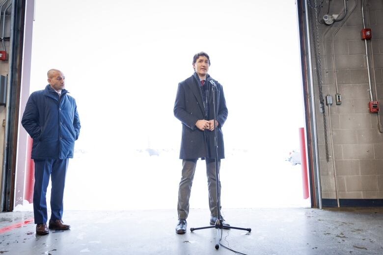 Prime Minister Justin Trudeau, joined by Yukon Premier Ranj Pillai, answers questions about a recently-downed aerial object during a press conference in Whitehorse, Yukon, on Feb. 13, 2023.