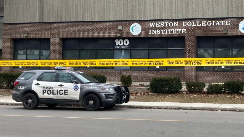 A photo of a police car and police tape outside Weston Collegiate Institute on Feb. 16.