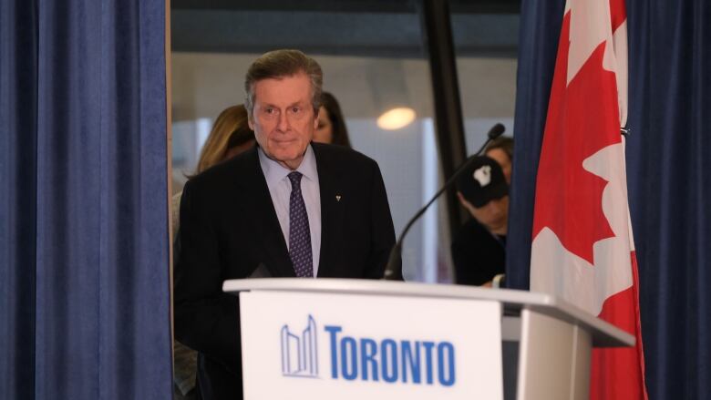 Mayor John Tory arrives at a press conference Friday before resigning his position. His departure comes a week after he admitted having an affair with a former staff member.