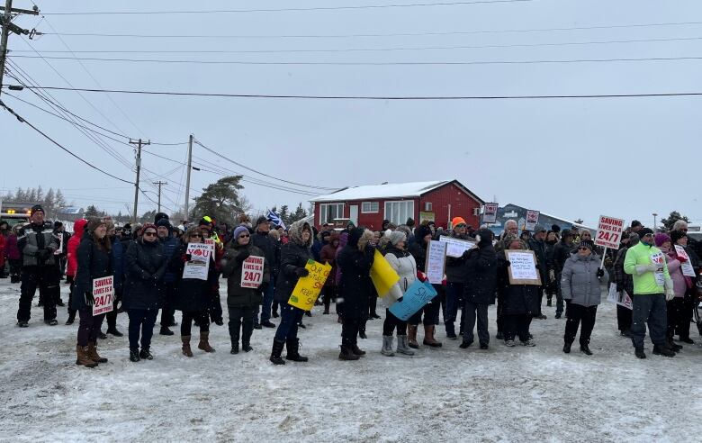 A group of protesters stands together.